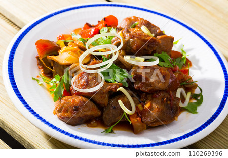 Meat stew with bell pepper, tomatoes, mushrooms (Kavarma) 110269396