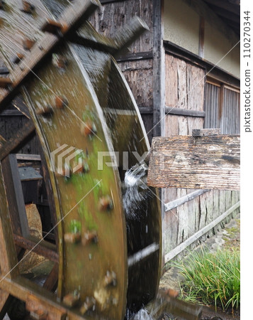 Landscape with a water wheel 110270344