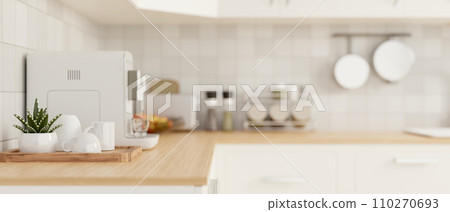 Side view of a kitchen countertop with kitchen appliances in a modern white kitchen. Side view of a kitchen countertop with kitchen appliances in a modern white kitchen. 110270693