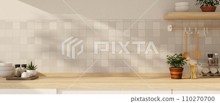 Copy space for displaying your product on a wooden kitchen countertop against the white tiles wall. 110270700