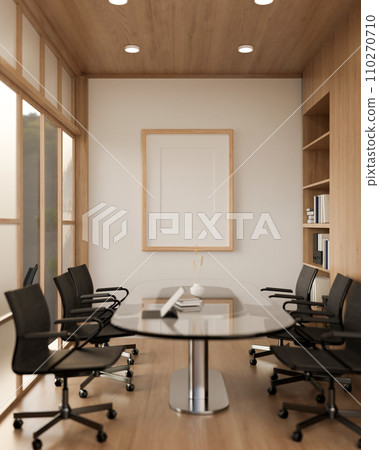 A minimal wood picture frame mockup on a white wall in a modern meeting room. A minimal wood picture frame mockup on a white wall in a modern meeting room. 110270710