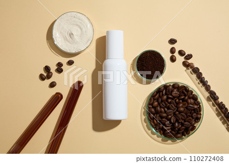 Mockup scene for advertising organic product with ingredient from coffee bean.Top view of white bottle without label decorated with coffee beans on test tubes and petri dish on beige background Mockup scene for advertising organic product with ingredient from coffee bean.Top view of white bottle without label decorated with coffee beans on test tubes and petri dish on beige background 110272408