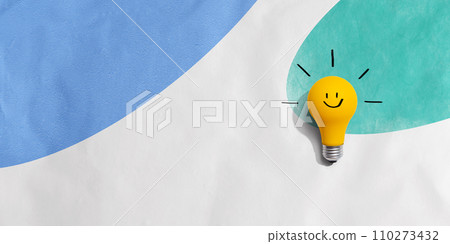 Yellow light bulb with happy face 110273432