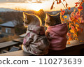 Two clothed kittens sitting comfortably looking at the sun. 110273639