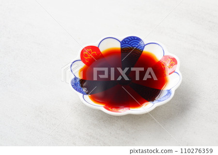 small plate with soy sauce small plate with soy sauce 110276359