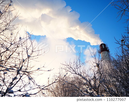 Smoke from a factory chimney. Ecological pollution. Air emissions polluting forest. Industrial waste. Industry metallurgical plant emissions. Smog and bad ecology. Central heating of CHP in winter. Smoke from a factory chimney. Ecological pollution. Air emissions polluting forest. Industrial waste. Industry metallurgical plant emissions. Smog and bad ecology. Central heating of CHP in winter. 110277007