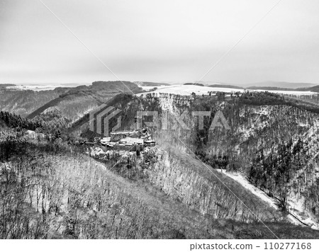 aerial view rock with medieval castle Ehrenburg near moselle river Brodenbach white winter snow wonderland forest hills 110277168