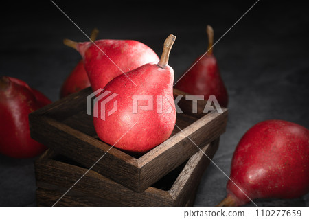 Red pear on wooden background Red pear on wooden background 110277659