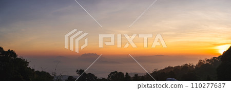 travel and people activity concept with twilight sky before sunrise with mountain and fog on foreground 110277687