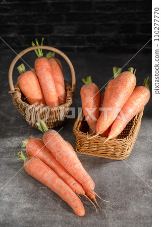fresh carrots on black background 110277770