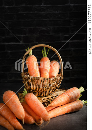 fresh carrots on black background fresh carrots on black background 110277781