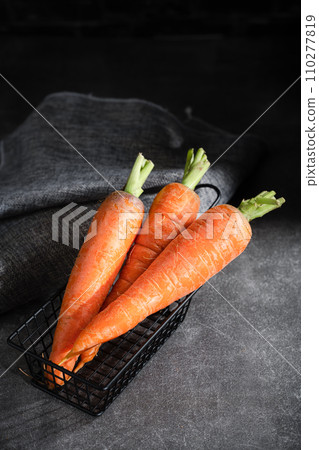 fresh carrots on black background 110277819