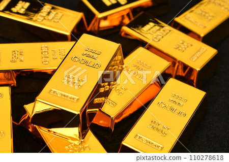 Close up photo a gold bar on black background Close up photo a gold bar on black background 110278618