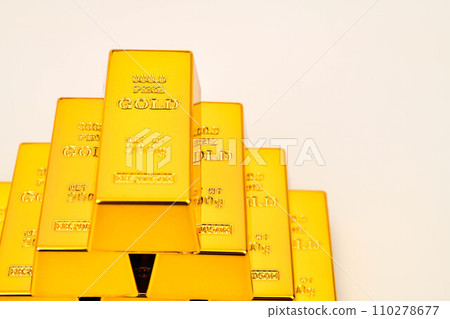 Close up photo a gold bar on white background 110278677