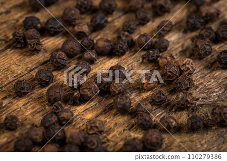 black pepper on wooden table black pepper on wooden table 110279386