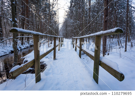 Wooden bridge in snow close-up Wooden bridge in snow close-up 110279695