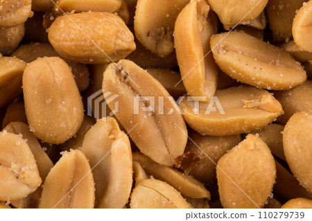 large amount of peeled salted peanuts 110279739