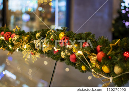 New Year's decorations on green spruce branches 110279990