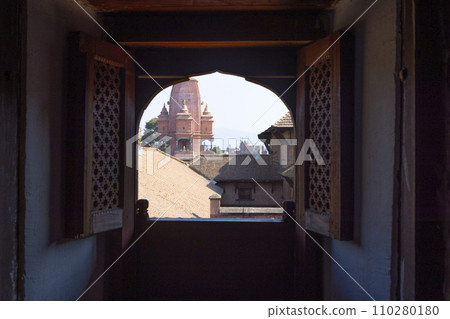 watch outside though Newar window window having the view of temple of Silu Mahadeva in Bhaktapur durbar square watch outside though Newar window window having the view of temple of Silu Mahadeva in Bhaktapur durbar square 110280180