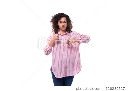 young curly brunette model woman dressed in a pink striped shirt shows like and dislike young curly brunette model woman dressed in a pink striped shirt shows like and dislike 110280517