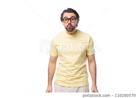 young caucasian man with black hair and beard looks at the camera in surprise 110280570
