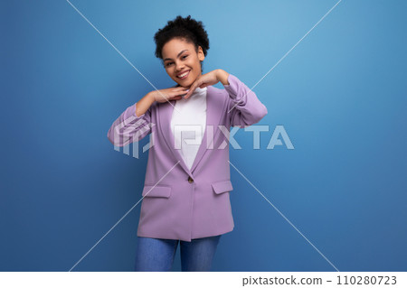 young positive successful latin business woman with tousled hairstyle dressed in a jacket young positive successful latin business woman with tousled hairstyle dressed in a jacket 110280723