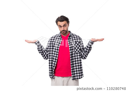 young brutal bearded brunette man in a shirt actively gesticulates on a white background with copy young brutal bearded brunette man in a shirt actively gesticulates on a white background with copy 110280748