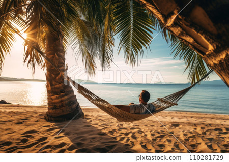 Relax in a beachfront hammock under swaying palms. Relax in a beachfront hammock under swaying palms. 110281729