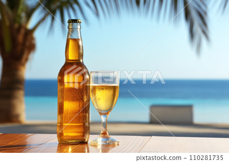A glass bottle of fresh open beer on a wooden table outdoors. A glass bottle of fresh open beer on a wooden table outdoors. 110281735