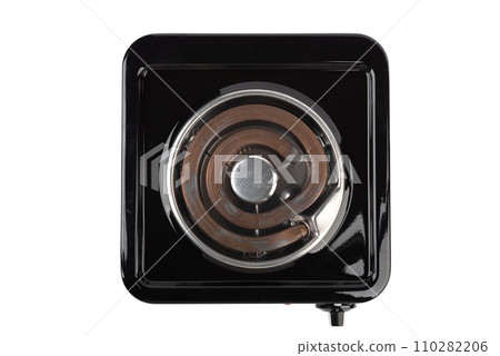 Top view of a tabletop electric stove with a spiral heating element. 110282206