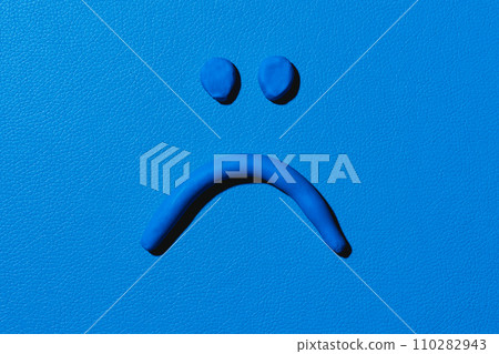 blue sad face made with modelling clay blue sad face made with modelling clay 110282943