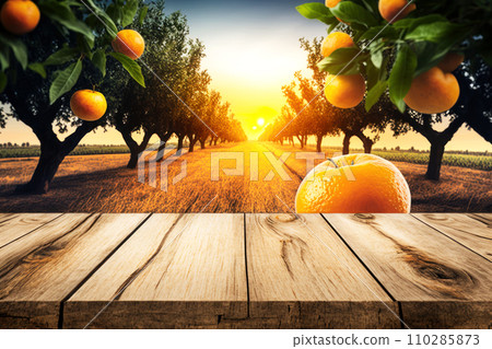 Table made of textured wooden boards in the foreground and apple orchards. Table made of textured wooden boards in the foreground and apple orchards. 110285873