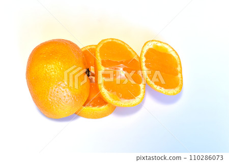 Mandarin and its slices on white. 110286073