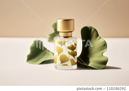 A beautiful glass bottle with herbal perfumes and ginkgo biloba leaves 110286292
