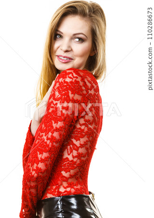 Elegant young woman wearing red top 110286673