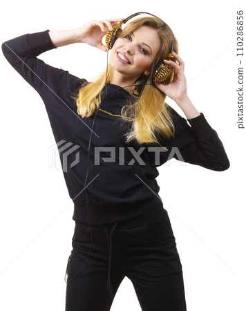 Teenage woman wearing headphones 110286856