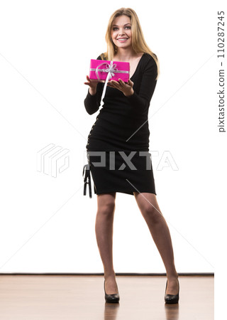 Girl holding pink gift box Girl holding pink gift box 110287245