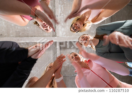 Circle of Motivation: Team Huddle from Below Circle of Motivation: Team Huddle from Below 110287510