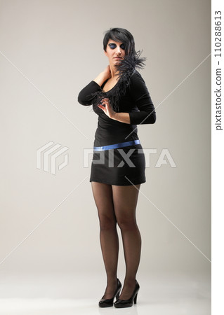 Beautiful woman black dress posing in studio Beautiful woman black dress posing in studio 110288613