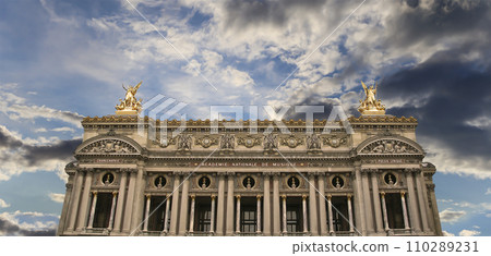 Opera Garnier (Garnier Palace)  against the background of a beautiful sky at sunset, Paris, France. Translation 110289231