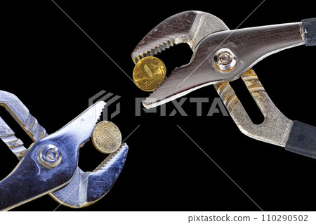 Allegory of the global financial crisis - Iron 10 rubles coin (written ten rubles, Bank of Russia in the Russian) in the grip of economic crisis, on a black background. Finance and business concept 110290502