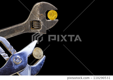Allegory of the global financial crisis - Iron 10 rubles coin (written ten rubles, Bank of Russia in the Russian) in the grip of economic crisis, on a black background. Finance and business concept Allegory of the global financial crisis - Iron 10 rubles coin (written ten rubles, Bank of Russia in the Russian) in the grip of economic crisis, on a black background. Finance and business concept 110290531
