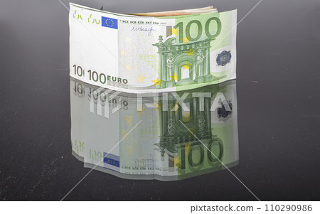 Euro banknotes, close-up, isolated on black background Euro banknotes, close-up, isolated on black background 110290986