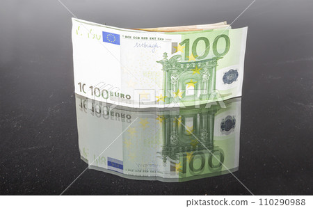 Euro banknotes, close-up, isolated on black background Euro banknotes, close-up, isolated on black background 110290988