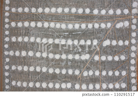 Aerial top view of farmers making heaps of raw sea salt piles with sea. Farm field outdoor. Nature material in traditional salt industry in Thailand. Asia culture. Agriculture lifestyle people Aerial top view of farmers making heaps of raw sea salt piles with sea. Farm field outdoor. Nature material in traditional salt industry in Thailand. Asia culture. Agriculture lifestyle people 110291517