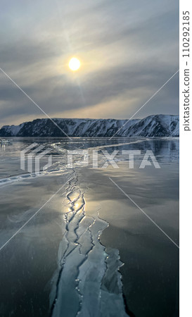 Landscape Shamanka rock natural ice breaking frozen water Lake Baikal Siberia Landscape Shamanka rock natural ice breaking frozen water Lake Baikal Siberia 110292185