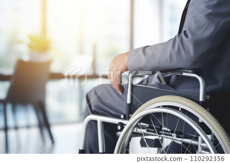 Disabled businessman in wheelchair in office. Generative AI 110292356