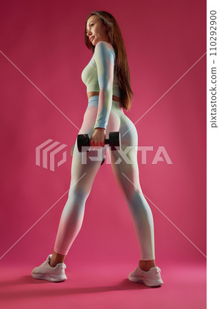 Sporty pretty woman in gym clothes exercising... - Stock Photo [110292900]  - PIXTA