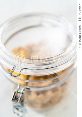 Making light brown sugar soft again with an apple core. Making light brown sugar soft again with an apple core. 110294667