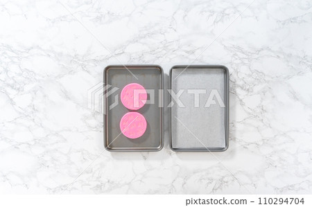 Flat lay. Preparing pink chocolate bows to decorate panda-shaped shortbread cookies. Flat lay. Preparing pink chocolate bows to decorate panda-shaped shortbread cookies. 110294704